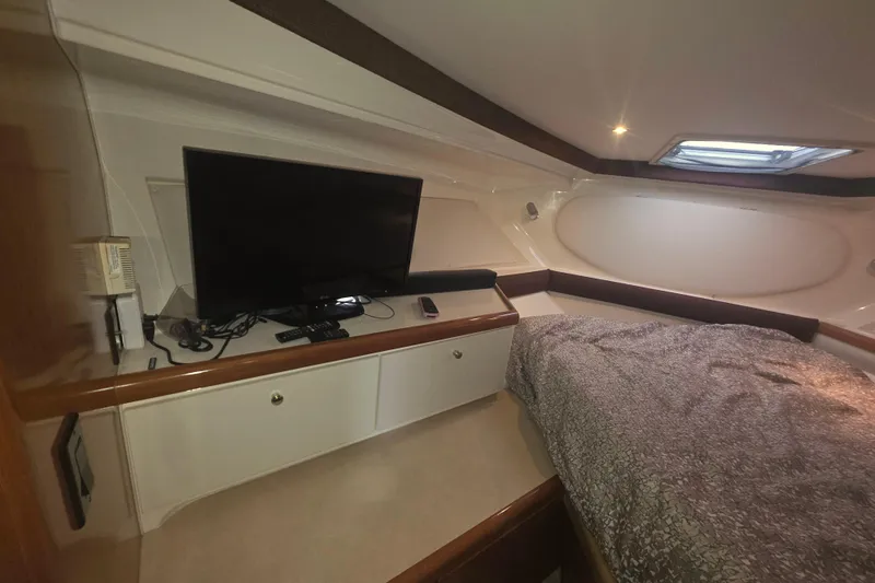 Slide: The Image of Interior of 2001 Carver 350 Mariner yacht with TV and cozy bed. - 27