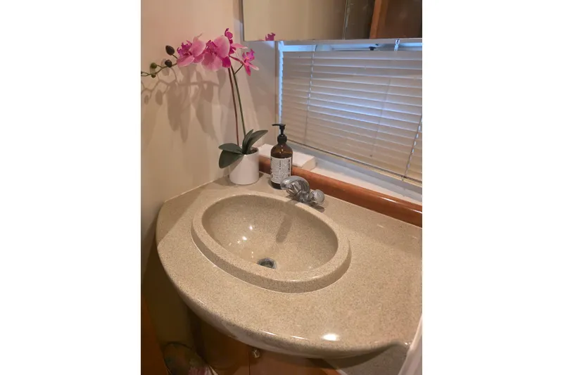 Slide: The Image of Bathroom sink with orchid and soap in 2001 Carver 350 Mariner yacht. - 33
