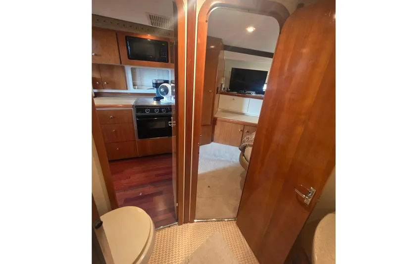 Slide: The Image of Interior of 2001 Carver 350 Mariner yacht with kitchen and living area. - 35