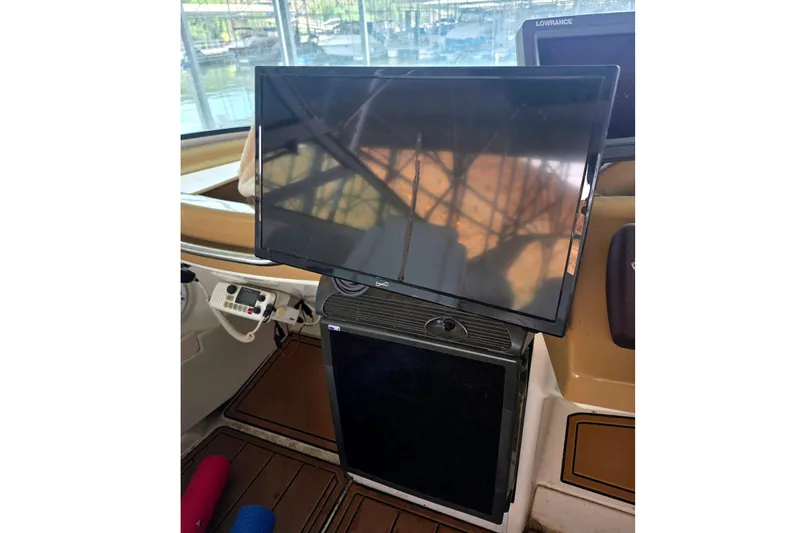 Slide: The Image of Flat-screen TV and equipment inside a 2001 Carver 350 Mariner boat cabin. - 37