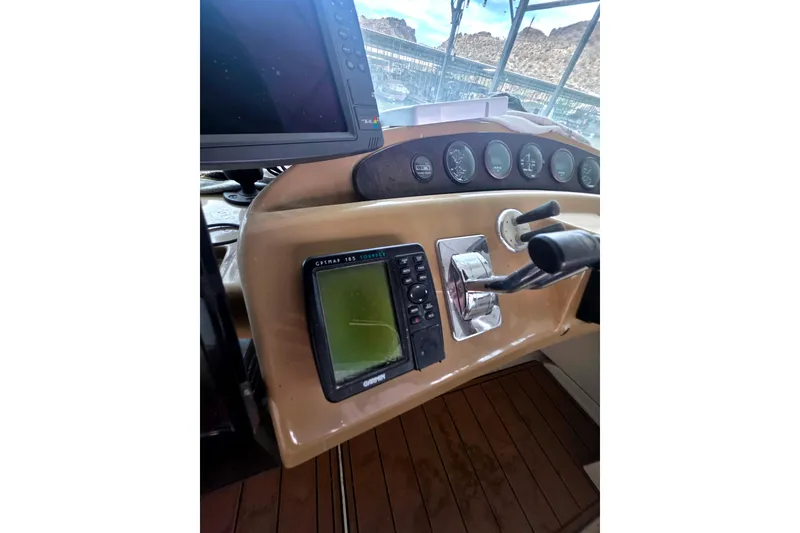 Slide: The Image of Helm of 2001 Carver 350 Mariner with navigation equipment and controls. - 39