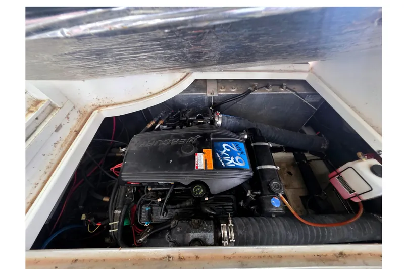 Slide: The Image of Engine compartment of a 2001 Carver 350 Mariner boat, featuring a MerCruiser engine. - 45