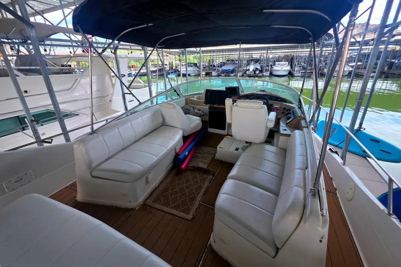 Slide: The Image of Spacious interior of a 2001 Carver 350 Mariner yacht with white seating and helm. - 7