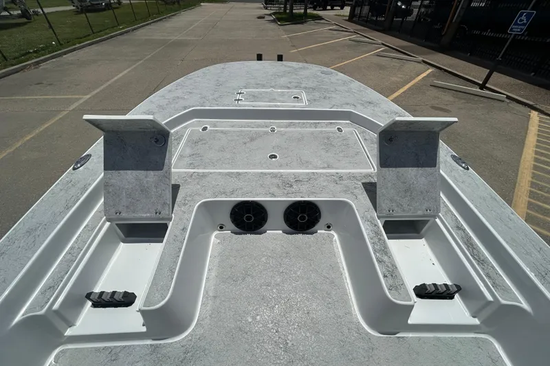 Slide: The Image of 2026 Gulf Coast Saber Cat 25 boat deck with storage compartments and speakers. - 11