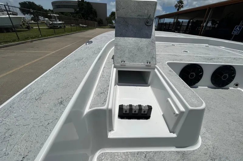 Slide: The Image of 2026 Gulf Coast Saber Cat 25 boat deck with open storage compartment. - 12