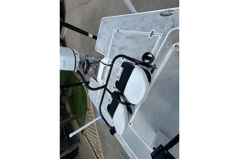Slide: The Image of 2026 Gulf Coast Saber Cat 25 boat deck with motor and seating. - 14