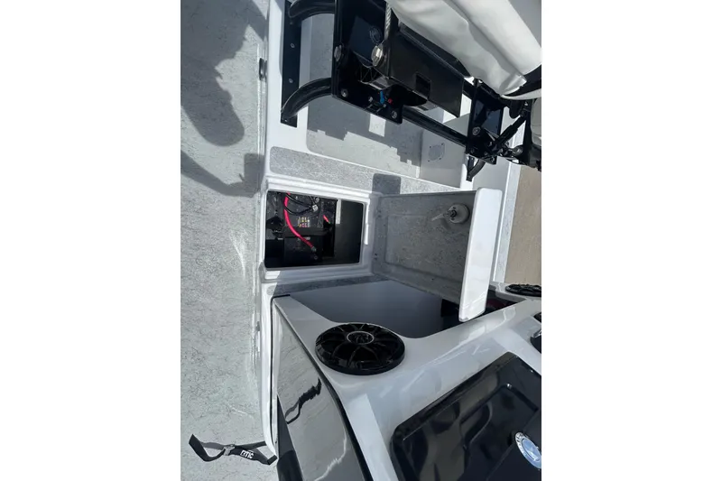 Slide: The Image of 2026 Gulf Coast Saber Cat 25 boat interior with open storage compartment and visible wiring. - 17