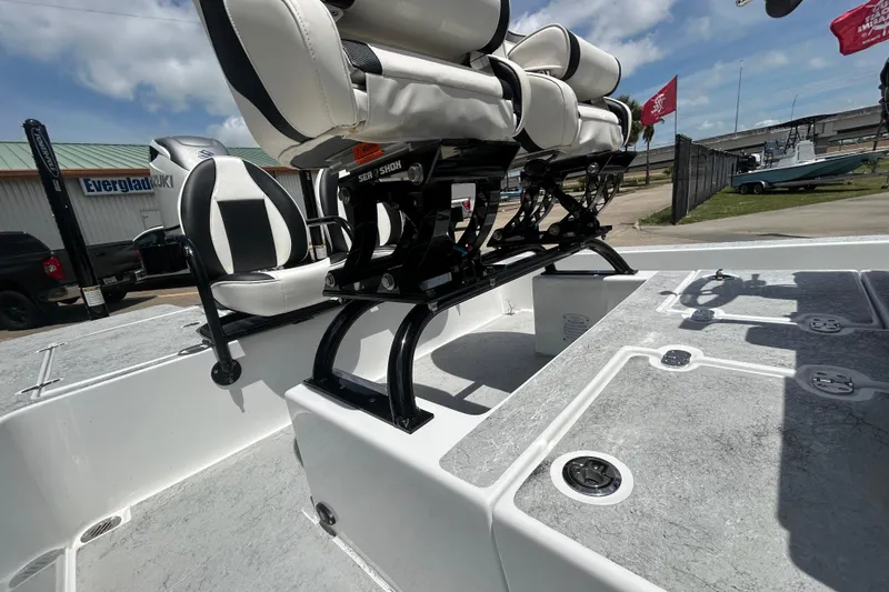 Slide: The Image of 2026 Gulf Coast Saber Cat 25 boat interior with seating and storage compartments. - 18