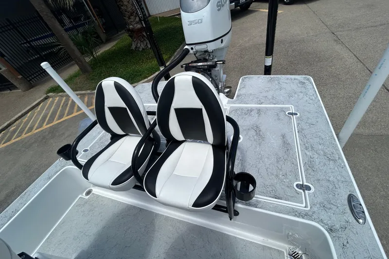 Slide: The Image of 2026 Gulf Coast Saber Cat 25 boat with dual seats and Suzuki 350 engine. - 19