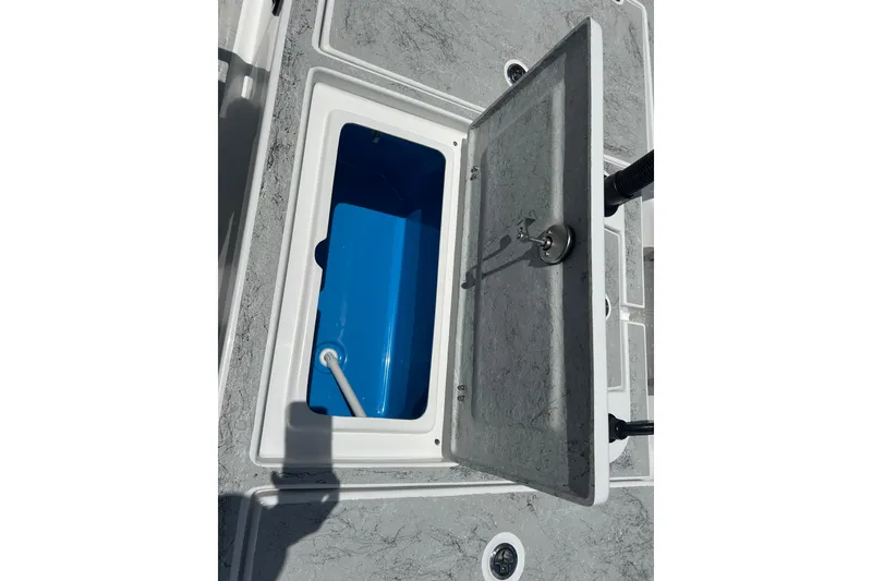 Slide: The Image of Open storage compartment on 2026 Gulf Coast Saber Cat 25 boat deck. - 26