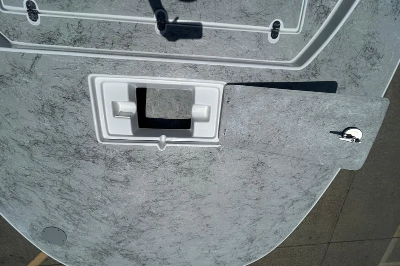 Slide: The Image of 2026 Gulf Coast Saber Cat 25 boat deck with open hatch and textured surface. - 8
