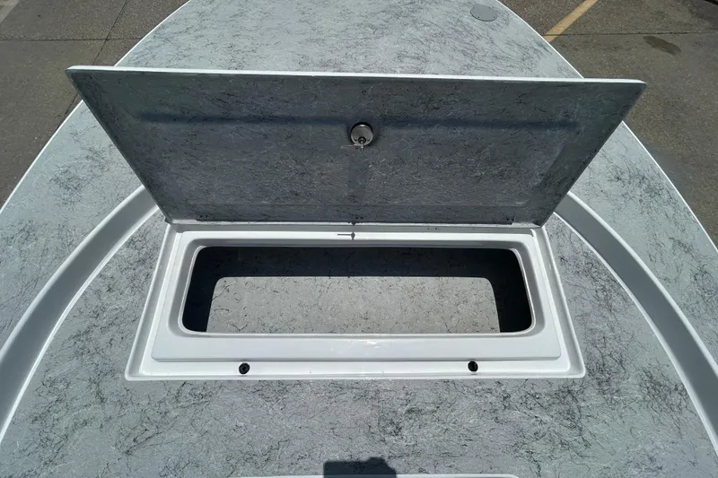 Slide: The Image of Open storage compartment on 2026 Gulf Coast Saber Cat 25 boat deck. - 9