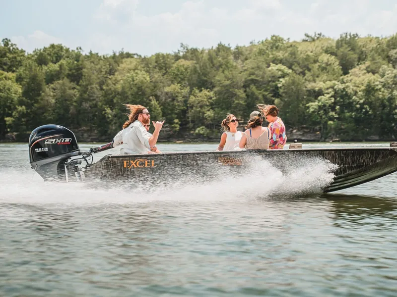 Slide: The Image of Excel Boats Tomahawk 183 from 2026 on a lake with passengers. - 10
