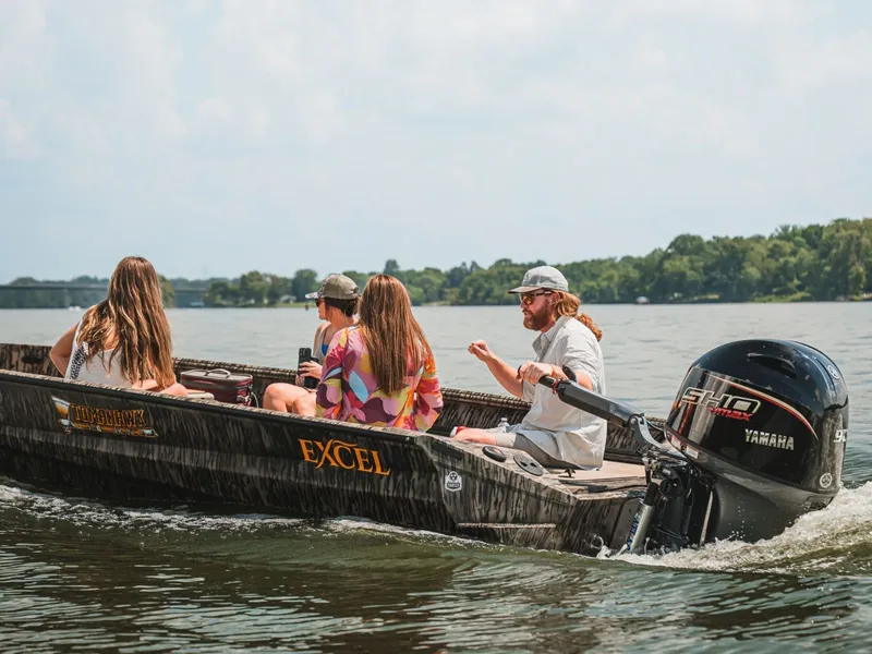 Slide: The Image of Excel Boats Tomahawk 183, 2026, cruising on a lake with passengers. - 18
