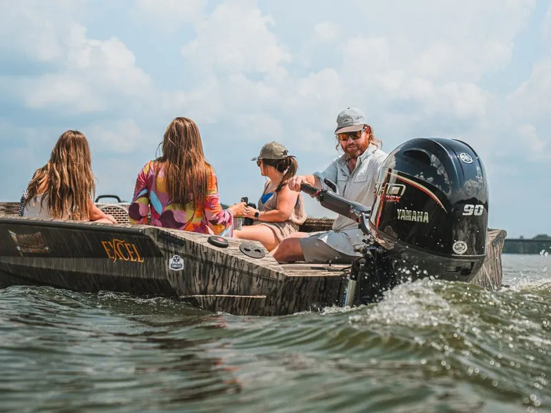 Slide: The Image of Family enjoying boat ride on Excel Tomahawk 183, 2026 model. - 19