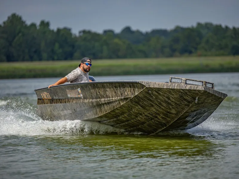 Slide: The Image of 2026 Excel Boats Tomahawk 183 speeding on a lake. - 20