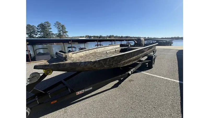 Slide: The Image of 2026 Excel Boats Tomahawk 183 on trailer by lakeside. - 4