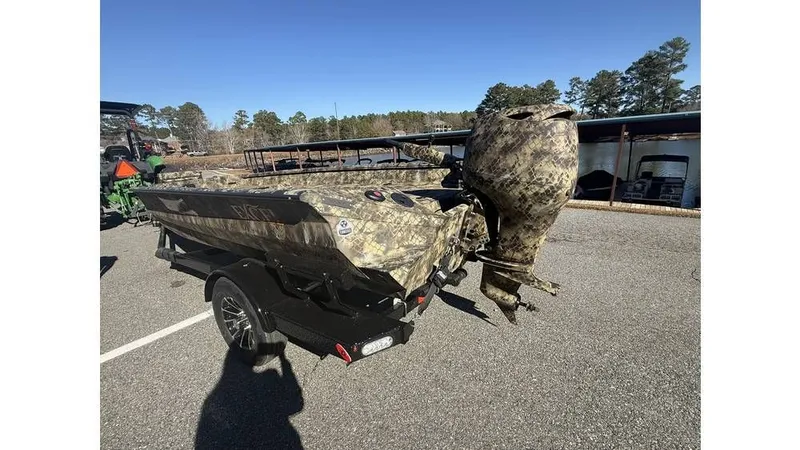 Slide: The Image of 2026 Excel Boats Tomahawk 183 with camouflage pattern on trailer. - 6