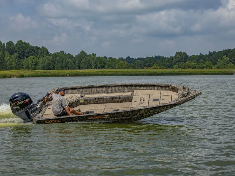 Slide: The Image of Excel Boats Tomahawk 183, 2026, cruising on a serene lake. - 8