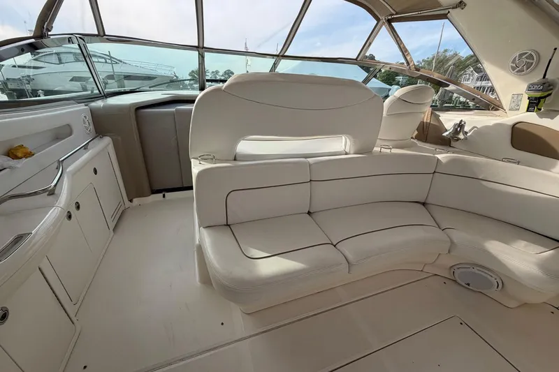 Slide: The Image of Interior of 2000 Sea Ray Sundancer 460 yacht with white leather seating and spacious layout. - 10