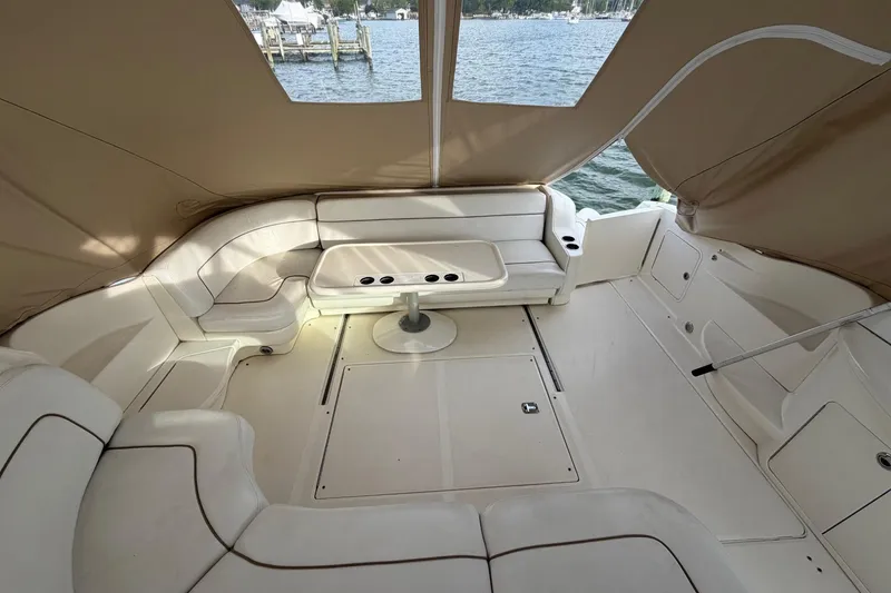 Slide: The Image of Spacious interior of 2000 Sea Ray Sundancer 460 yacht with comfortable seating and table. - 11