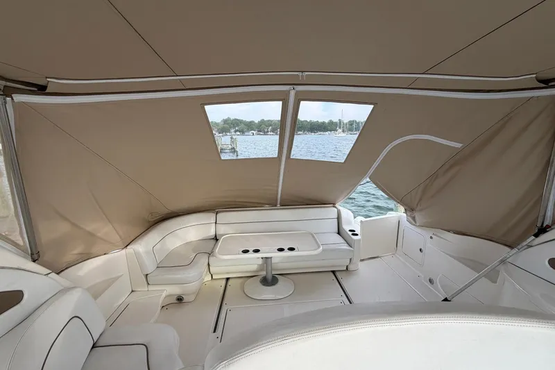 Slide: The Image of Interior view of 2000 Sea Ray Sundancer 460 yacht with beige seating and water backdrop. - 19