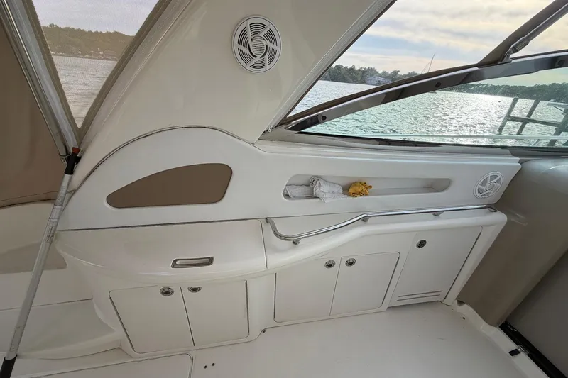 Slide: The Image of Interior view of a 2000 Sea Ray Sundancer 460 yacht with storage cabinets and window. - 20