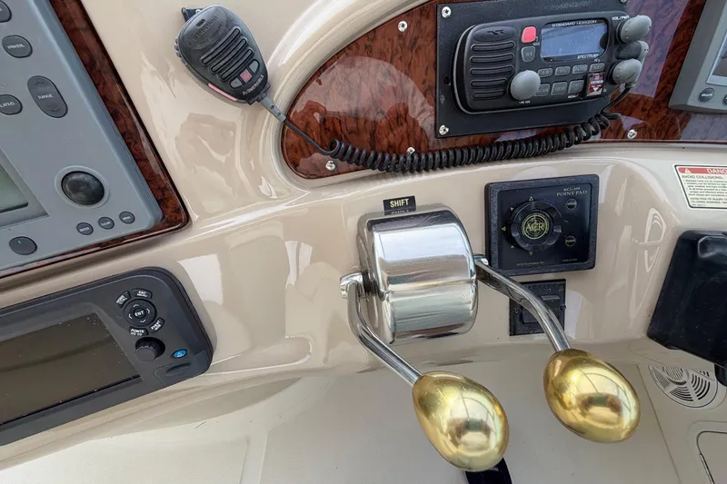 Slide: The Image of Control panel of a 2000 Sea Ray Sundancer 460 yacht with navigation equipment. - 23