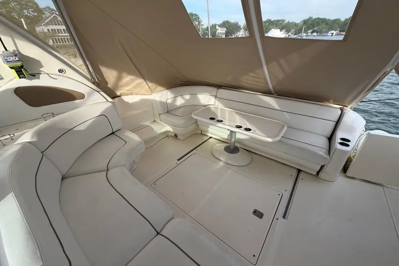 Slide: The Image of Luxurious interior of 2000 Sea Ray Sundancer 460 yacht with plush seating and table. - 24