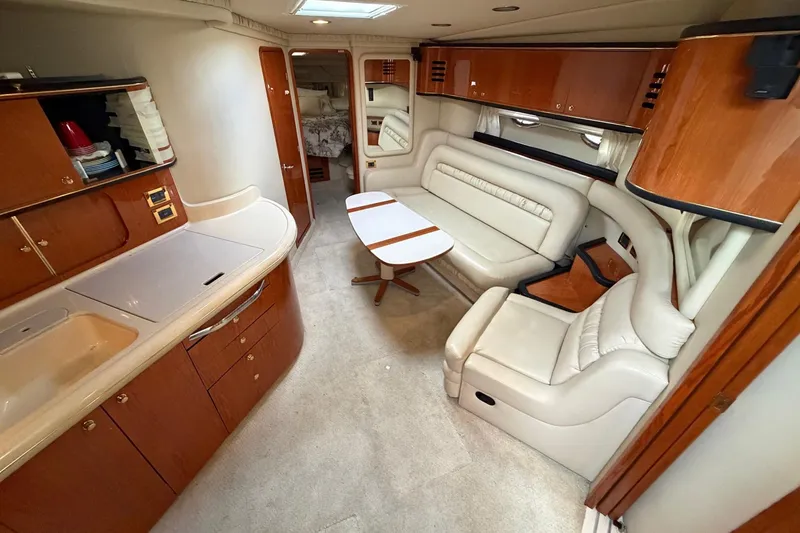 Slide: The Image of Luxurious interior of a 2000 Sea Ray Sundancer 460 yacht with elegant seating and cabinetry. - 25