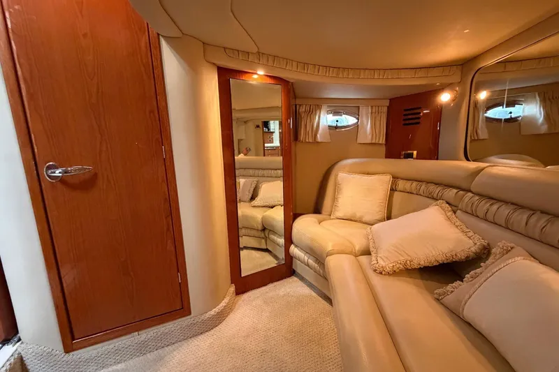 Slide: The Image of Luxurious interior of 2000 Sea Ray Sundancer 460 yacht with plush seating and elegant decor. - 31