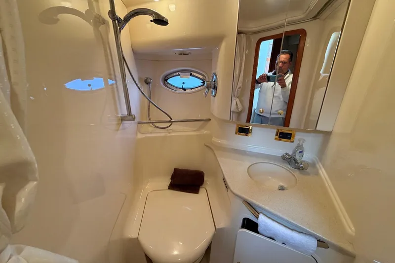 Slide: The Image of Bathroom interior of 2000 Sea Ray Sundancer 460 yacht, featuring shower and sink. - 34