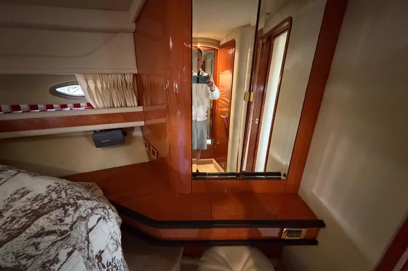 Slide: The Image of Interior of 2000 Sea Ray Sundancer 460 yacht cabin with wood finish and mirror. - 37