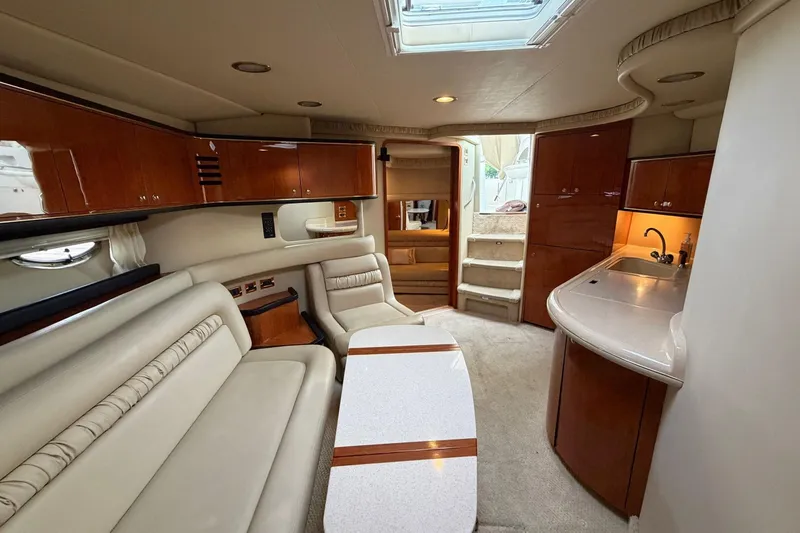 Slide: The Image of Luxurious interior of 2000 Sea Ray Sundancer 460 yacht with elegant seating and cabinetry. - 39