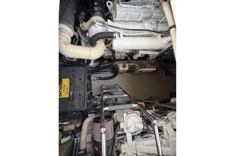 Slide: The Image of Engine compartment of a 2000 Sea Ray Sundancer 460 yacht, showcasing mechanical components. - 40