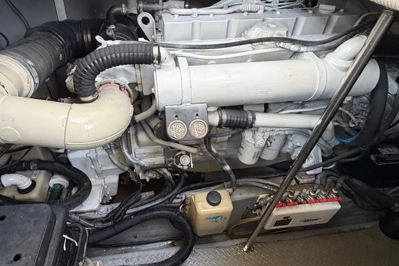 Slide: The Image of Engine compartment of a 2000 Sea Ray Sundancer 460 yacht, showcasing mechanical components. - 42