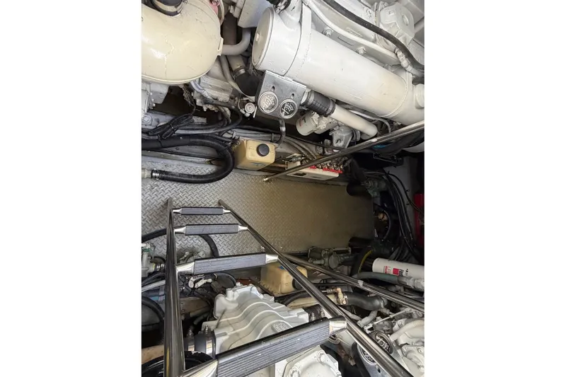 Slide: The Image of Engine room of a 2000 Sea Ray Sundancer 460 yacht, showcasing mechanical components. - 43