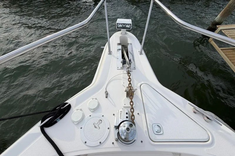 Slide: The Image of Bow of 2000 Sea Ray Sundancer 460 yacht with anchor chain and water view. - 6