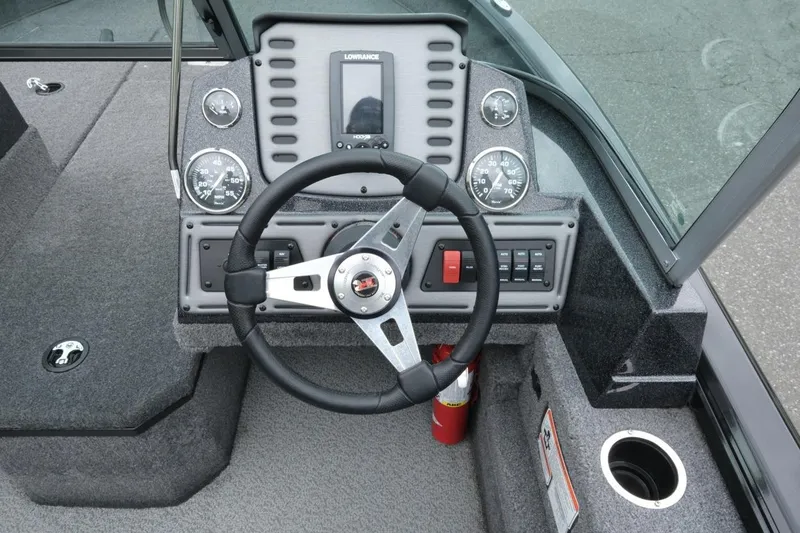Slide: The Image of 2018 Ranger VS1670 WT boat dashboard with steering wheel and gauges. - 11