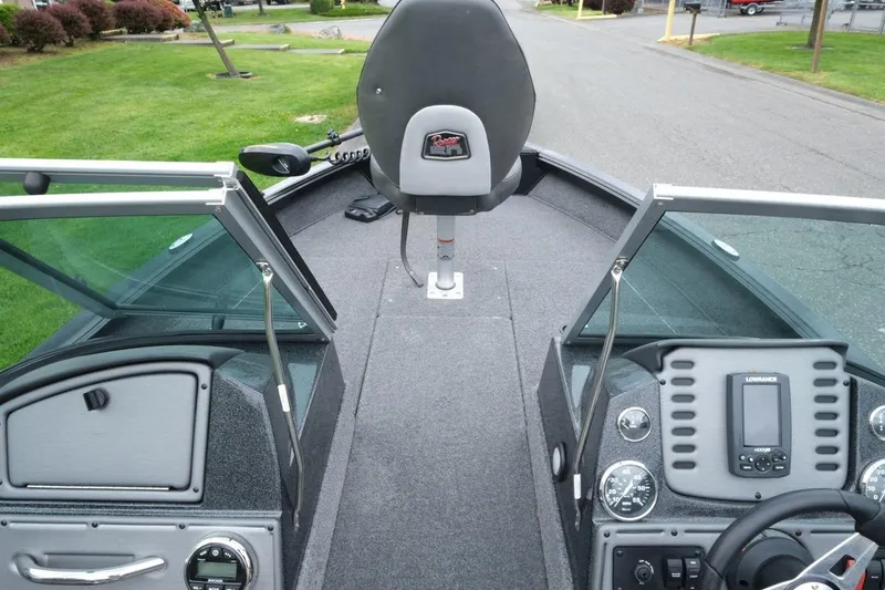 Slide: The Image of 2018 Ranger VS1670 WT boat interior with steering console and seating. - 12