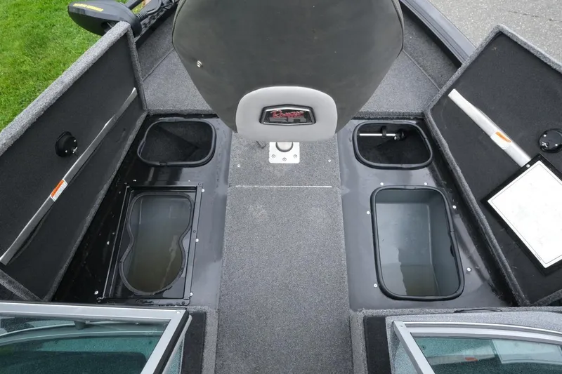 Slide: The Image of 2018 Ranger VS1670 WT boat interior with storage compartments and seating. - 13