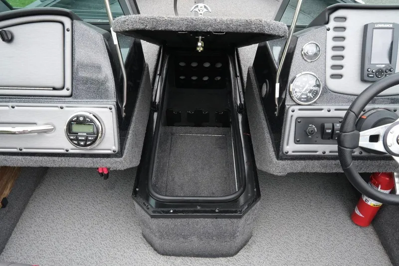 Slide: The Image of 2018 Ranger VS1670 WT boat interior with dashboard, steering wheel, and storage compartment. - 14
