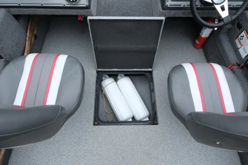 Slide: The Image of 2018 Ranger VS1670 WT boat interior with storage compartment and two seats. - 15