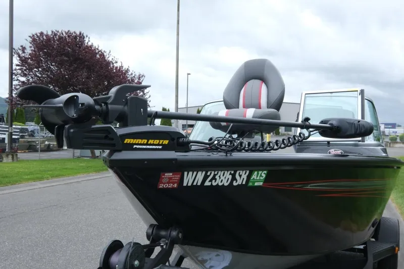 Slide: The Image of 2018 Ranger VS1670 WT boat with Minn Kota PowerDrive motor, parked outdoors. - 16