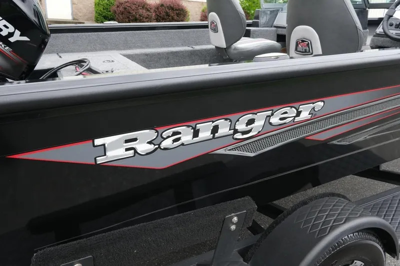Slide: The Image of 2018 Ranger VS1670 WT boat with sleek black design and bold logo. - 19