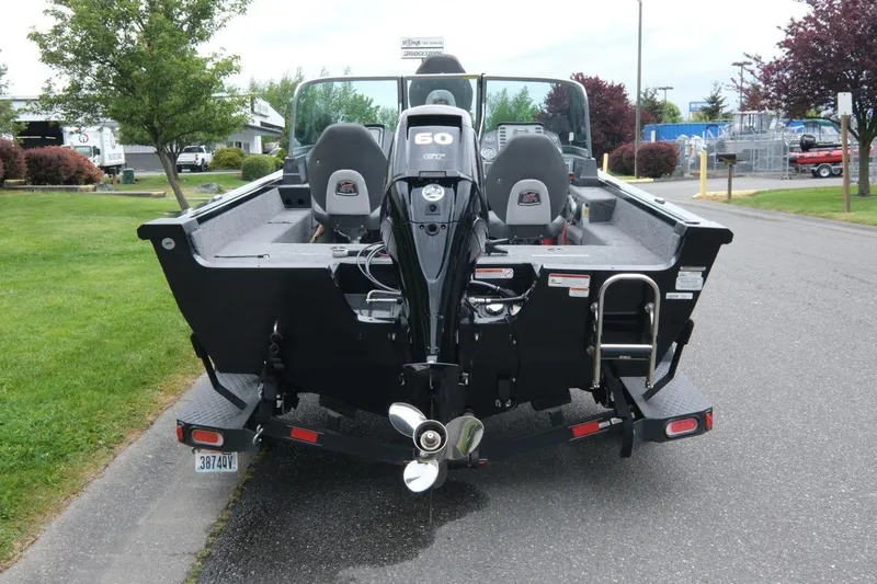 Slide: The Image of 2018 Ranger VS1670 WT boat with outboard motor, parked on a street. - 4