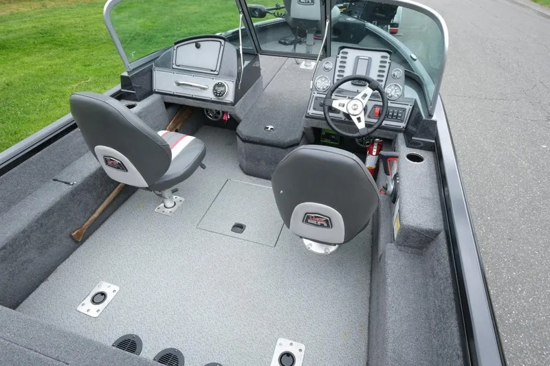 Slide: The Image of 2018 Ranger VS1670 WT boat interior with dual seats and steering console. - 8