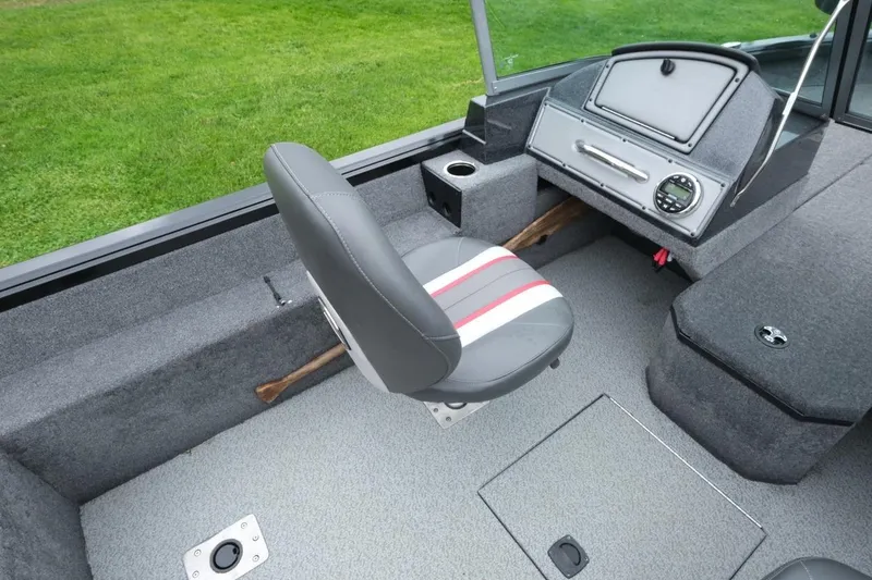 Slide: The Image of 2018 Ranger VS1670 WT boat interior with gray seating and dashboard. - 9