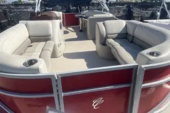 Slide: The Image of 2023 Cypress Cay Seabreeze 232 pontoon boat with spacious seating and red exterior. - 7