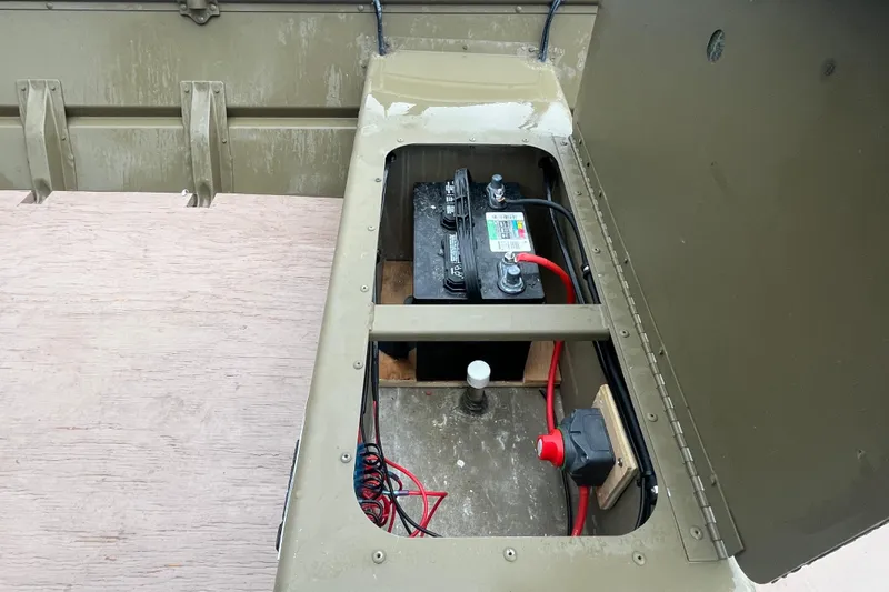 Slide: The Image of Battery compartment of 2025 G3 Gator Tough 1436 boat, showing wiring and connections. - 5
